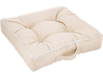 A beige tufted outdoor seat pad with white piping and a handle.