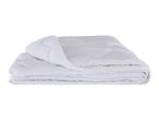 Folded white quilted duvet or comforter