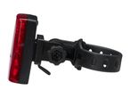 Red bicycle rear light with a black adjustable strap and mounting bracket.