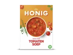 Een verpakking voor tomatensoep met een kom soep, tomaten, kruiden en de tekst 'HONIG' en 'BASIS VOOR TOMATEN SOEP'.