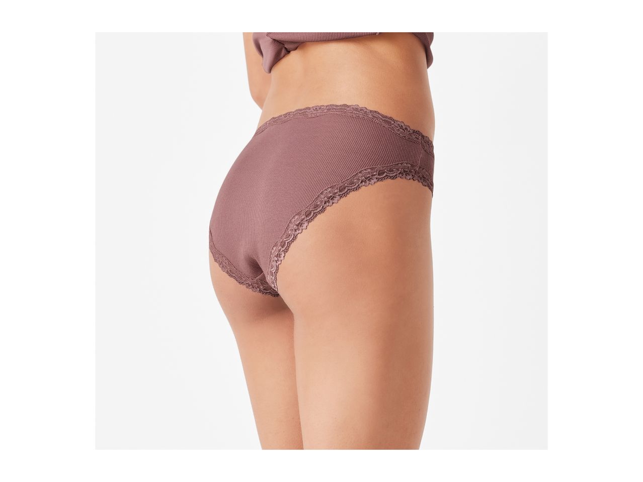 Woman wearing ribbed, lace-trimmed briefs in a mauve color.