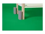 Wooden furniture legs with grey plastic inserts on a green background.