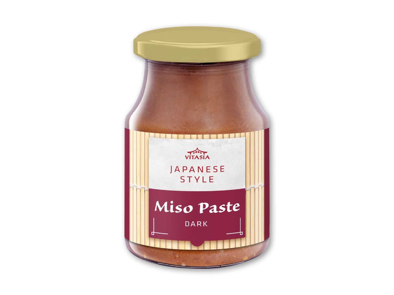 Mørk misopasta i japansk stil i en glasbeholder med guldlåg.