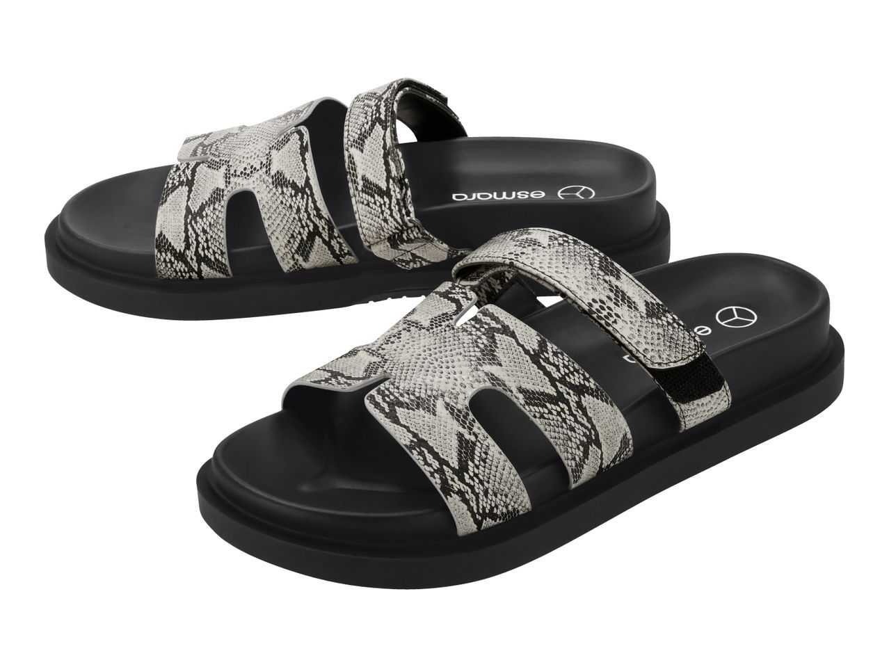Pair of women's sandals with black soles and grey snakeskin-patterned straps.