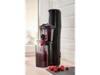 SILVERCREST® Premium Slow Juicer making berry juice, with fresh berries on a slate board.