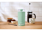 Moedor de café SilverCrest verde menta com acessórios de café.