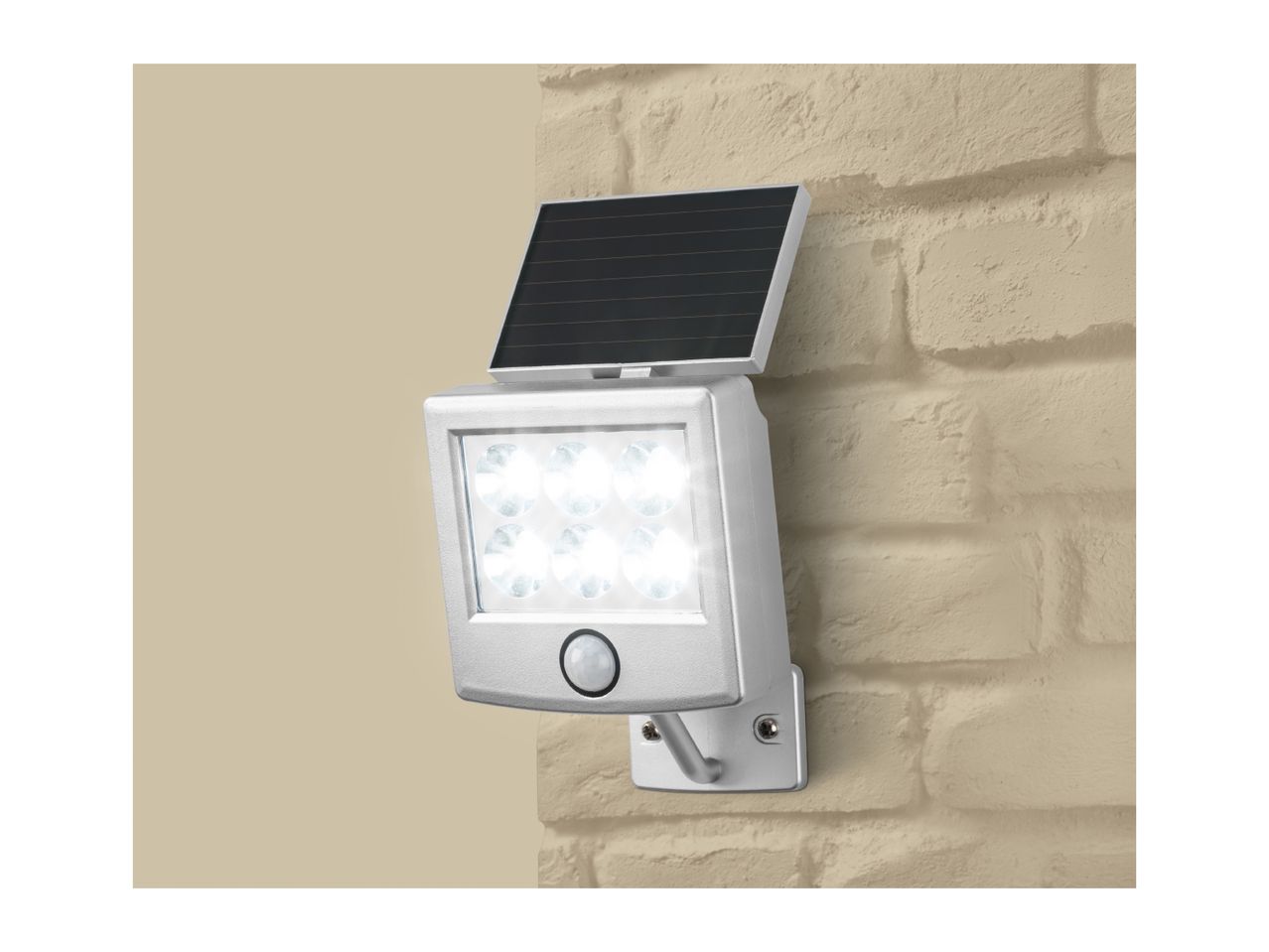 Solar-powered LED wall light with motion sensor mounted on a brick wall