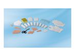 A variety of first aid supplies, including bandages, gauze, tape, masks, and gloves.