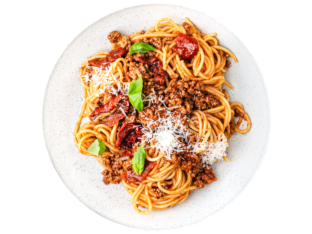 Spaghetti bolognese with grated cheese, sun-dried tomatoes, and basil leaves on a white plate.
