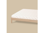 Livarno Jersey Fitted Sheet with a strawberry pattern on a wooden bed frame.