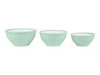 Set of three light green mixing bowls with white interiors, varying in size.