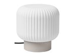 Modern table lamp with a ribbed white glass shade and a grey base