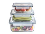 Stack of three glass food containers with fresh fruit and vegetables
