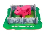 A pink toy pig in a cardboard fence on a green base with the text 'HERD MENTALITY'.