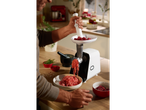 Man mincing meat with a SILVERCREST® 300W Electric Mincer in a kitchen.