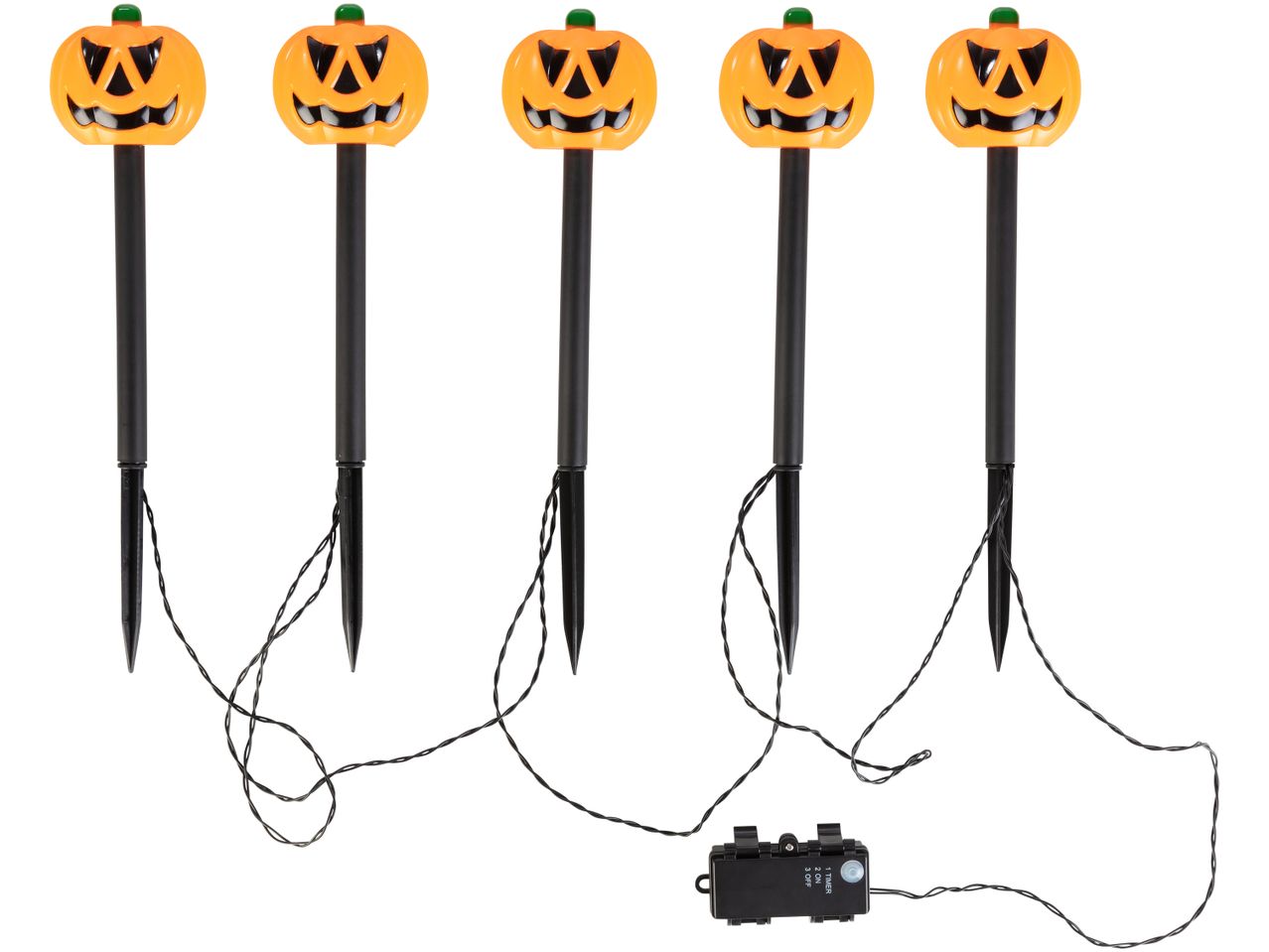 Five Halloween pumpkin pathway lights with stakes and a battery pack.
