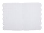 Open graph paper notebook with scalloped edges