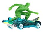 Green surfer toy on a blue wave-themed toy car with a surfboard