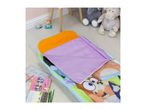 A child's sleeping bag with cartoon characters, a book, and coloring pencils on a rug.
