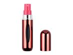 Rose gold refillable perfume atomizer spray bottle with cap.