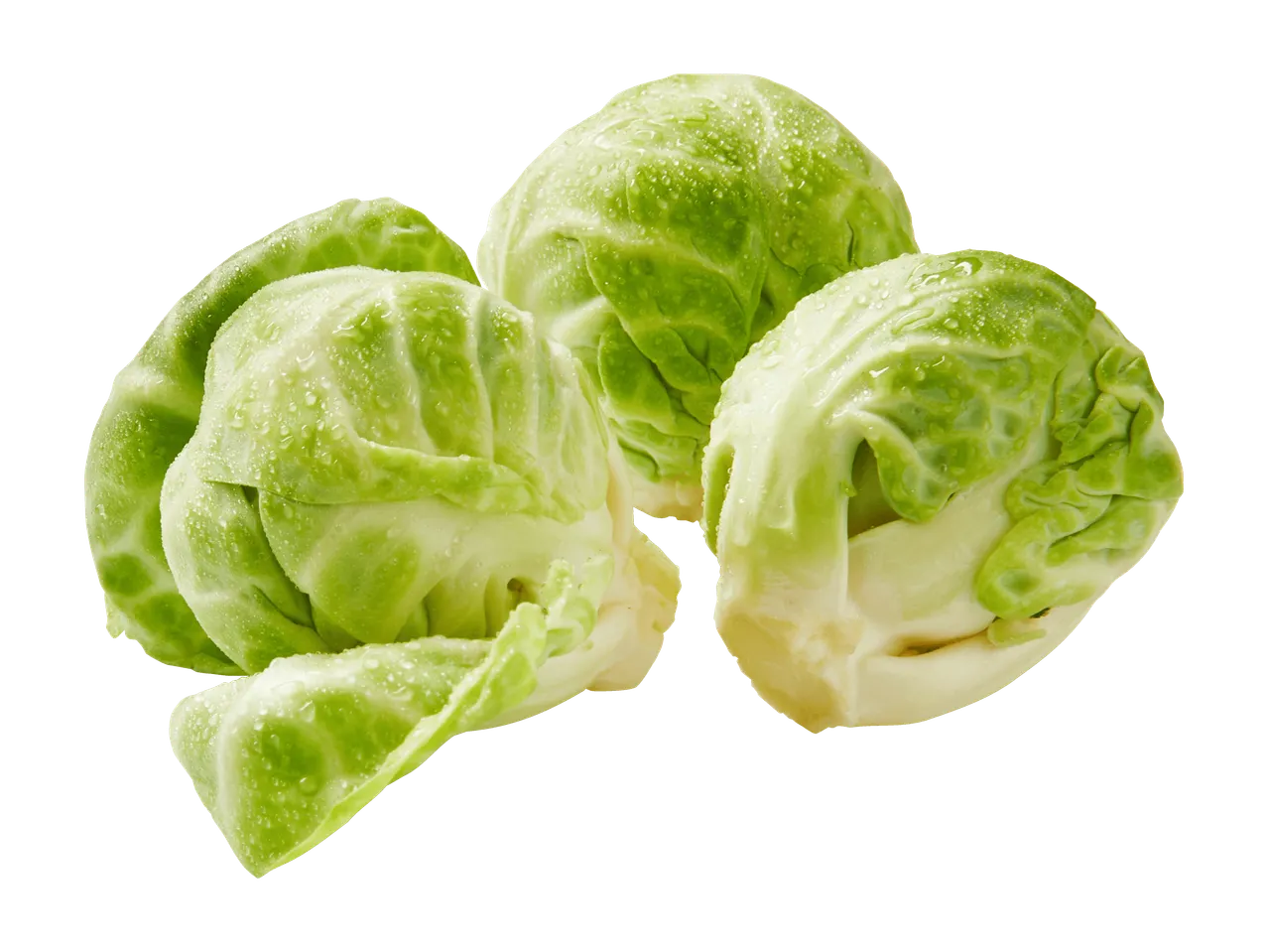 Kolme tuoretta ruusukaalia mustalla taustalla.