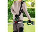 Person with PARKSIDE® cordless pole saw in a garden