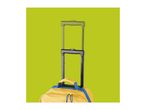 Yellow backpack with blue accents and an extended black telescopic handle against a green background.
