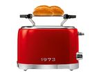 Red retro toaster with integrated warming rack and two bread rolls