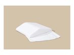 White wedge pillow with a textured cover on a beige background.
