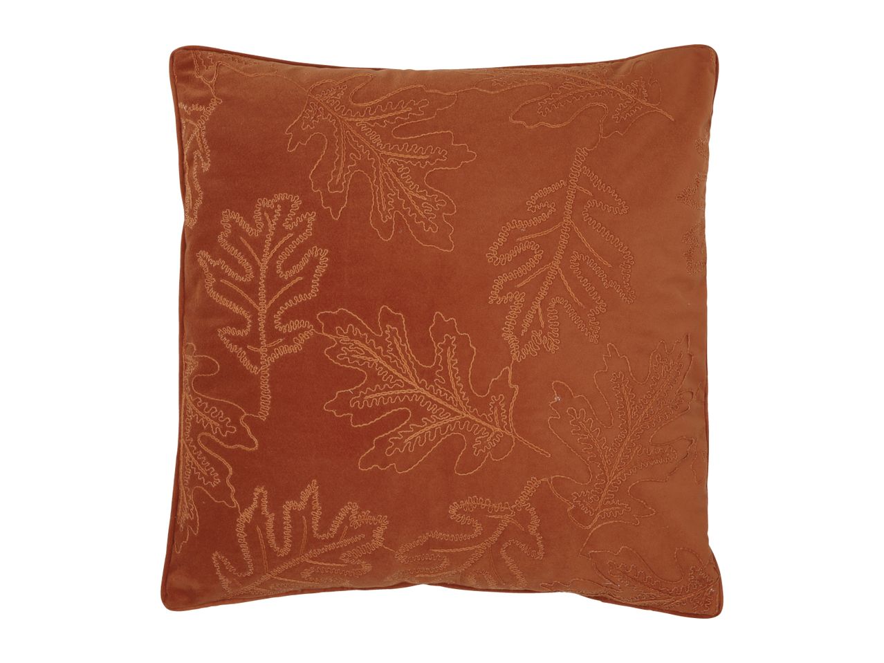 Orange cushion with embroidered leaf patterns