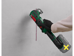 Parkside® cordless multi-tool cutting into a wall.