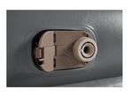 Close-up of a beige air valve on a gray inflatable surface
