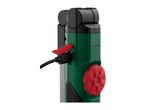 Close-up of a green and black portable work light with a red USB port cover and charging cable.