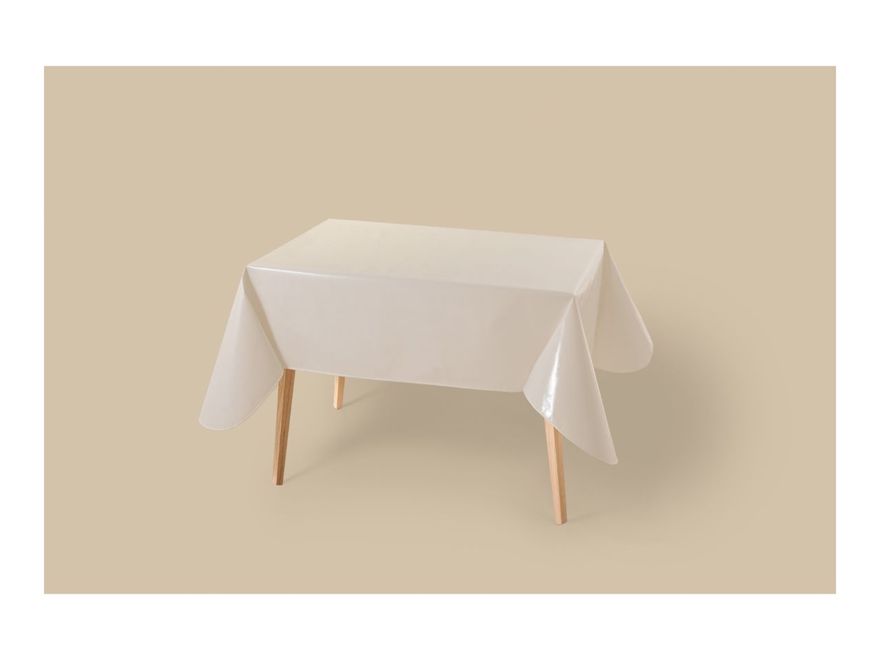 A rectangular table covered with a translucent, light-colored tablecloth on a beige background.