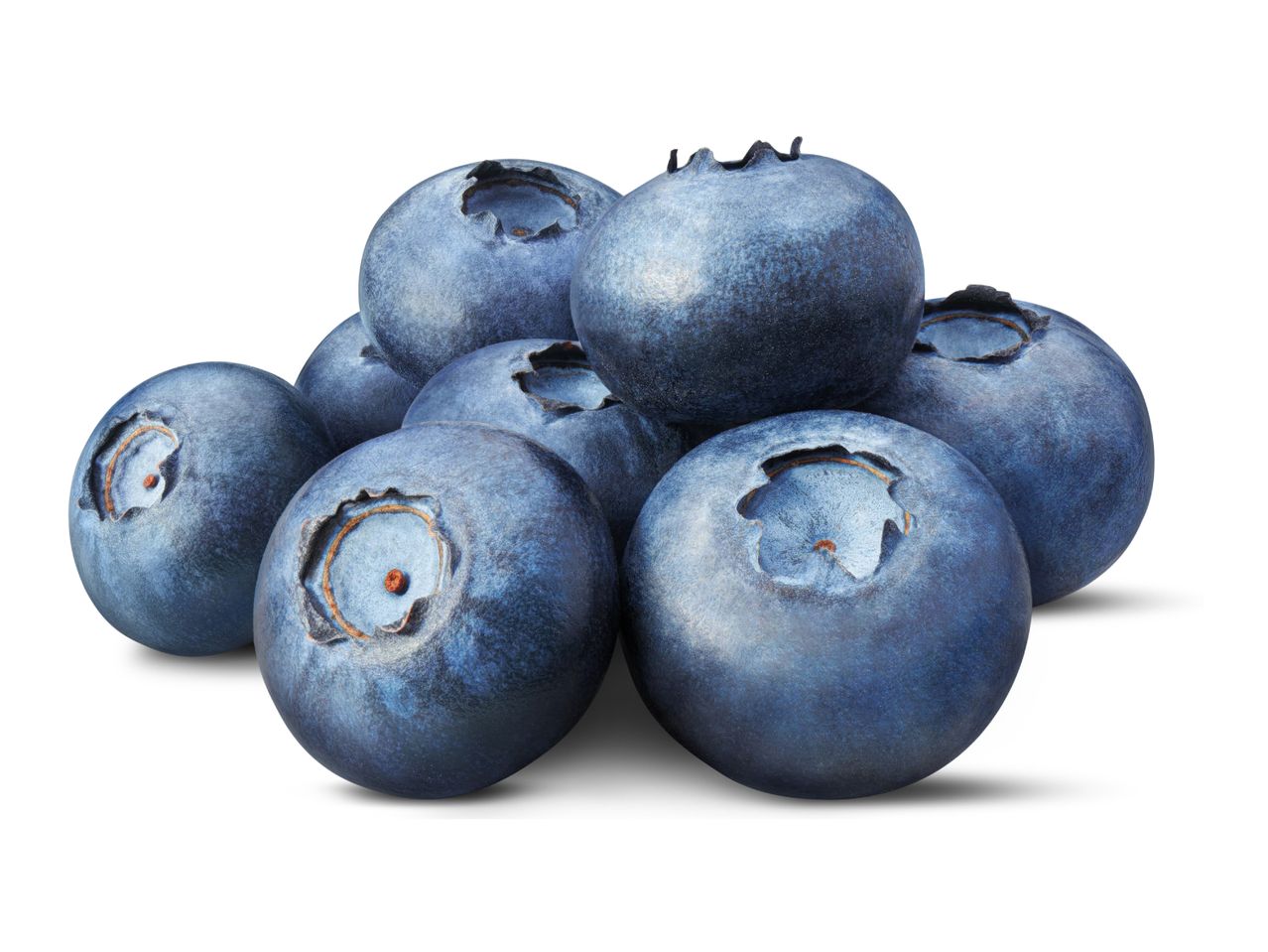 A pile of fresh, ripe blueberries with a light white bloom, isolated on a white background.
