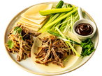 Peking duck with pancakes, cucumber, scallions, and hoisin sauce.