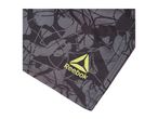Close-up of dark grey athletic shorts with a lighter grey abstract pattern and a yellow logo.