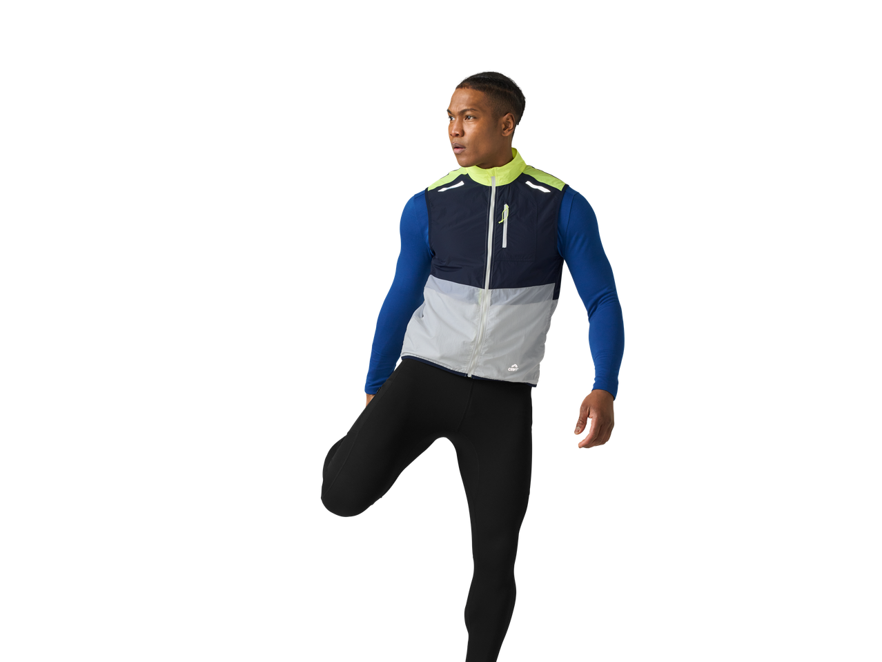 A young man stretching in a Crivit running jacket and tights.