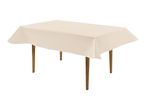 Rectangular table with a light beige tablecloth and wooden legs