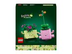 Green box with two rocking plant toys, one light green with pink flowers and one pink with green leaves.