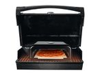 Pizzas on a grill with a pizza stone.