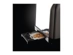 Toaster with a crumb tray pulled out, filled with breadcrumbs.
