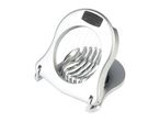 A silver egg slicer sits on a white background.