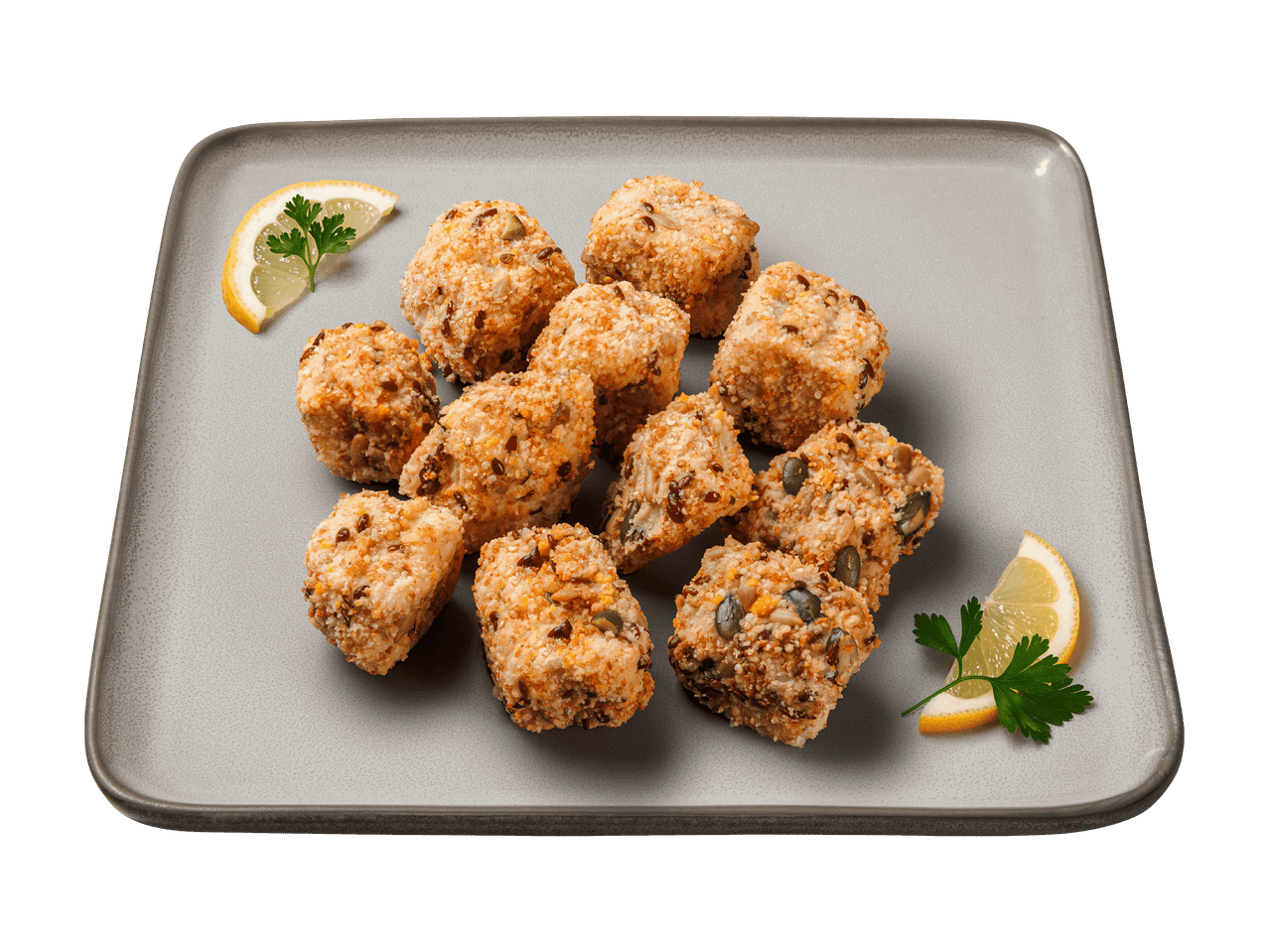Nuggets de poulet panés aux graines, garnis de citron et de persil sur une assiette.