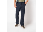 Man wearing dark blue drawstring trousers, a striped t-shirt, and brown sneakers.