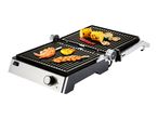 A silver and black contact grill with food cooking on both plates.