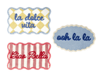 Tre tuftede tæpper med teksterne 'la dolce vita', 'ooh la la' og 'Ciao Bella'.