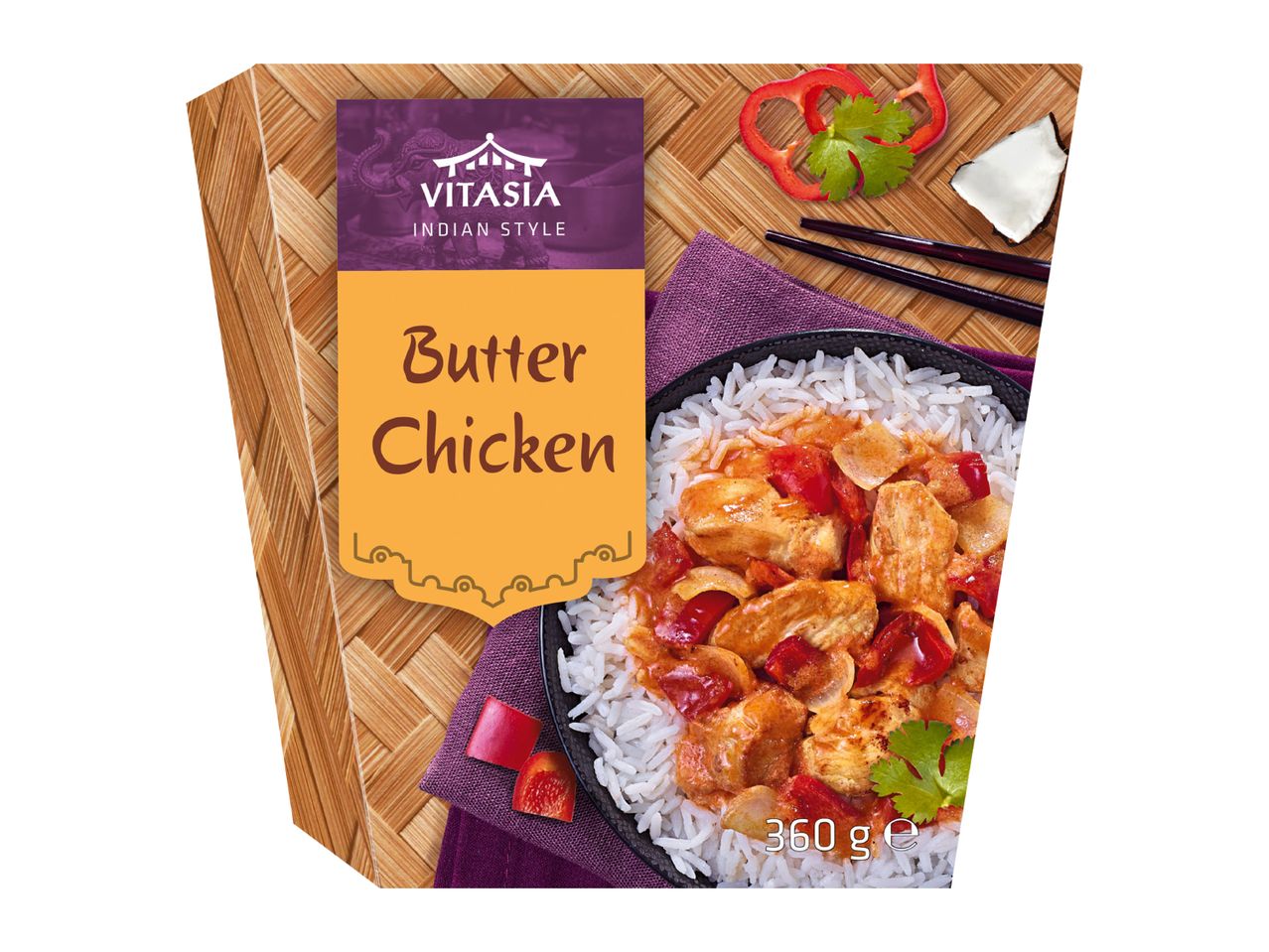 Butter Chicken with rice, red peppers, and cilantro, on a woven mat.