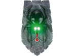 A Halloween-themed spider doorbell with glowing green eyes and a red button.