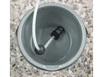 PARKSIDE cordless water jet pump in a bucket with water.